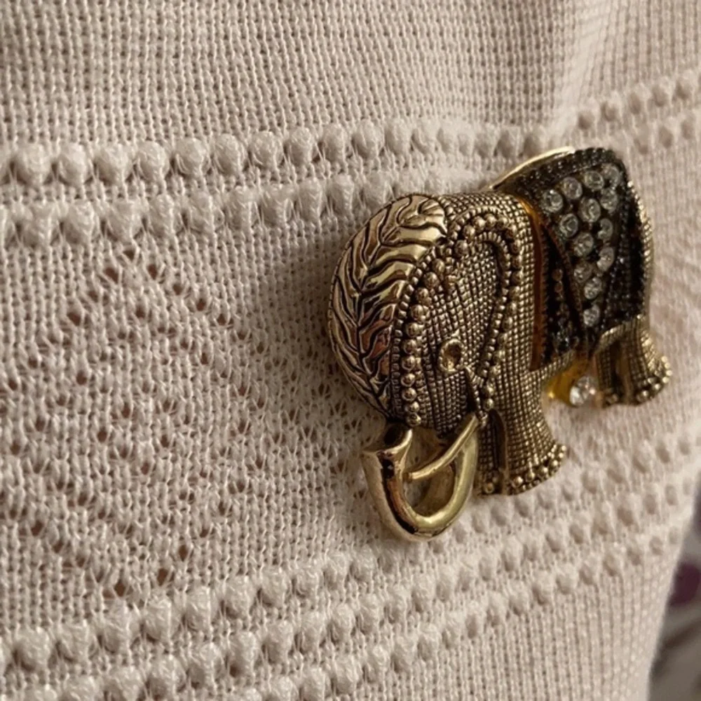 Gorgeous gold tone and crystal elephant brooch